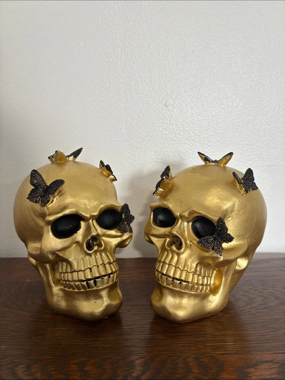 NWT- Set of 2- STUNNING- Gold Skull Statues with Black Butterflies Accents